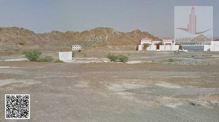 For sale in Ajman, residential/commercial land in Masfout, Block 1, corner plot on two streets, 3230 sq ft, G+1. Asking price: 250,000