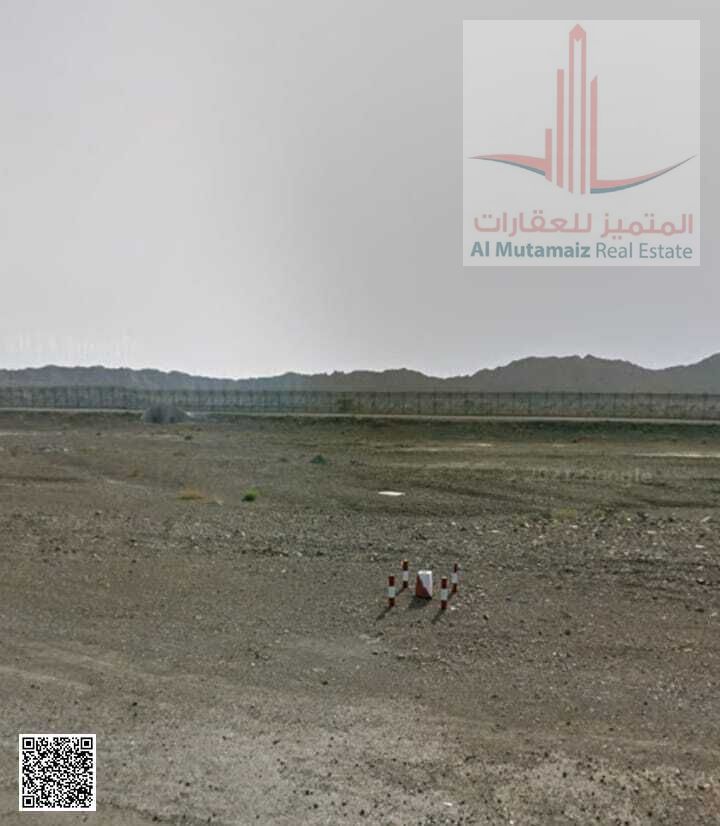 Land for sale in Ajman, Masfout - Basin 1, 4305 sq ft. Building permit for residential/commercial ground floor and two floors. Asking AED 170,000