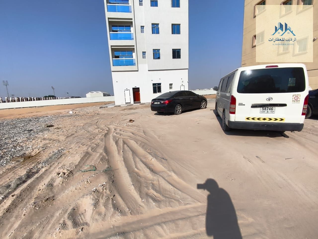 Residential/commercial land for sale (ground floor + three floors) — Al Alia area, Ajman, close to the main road