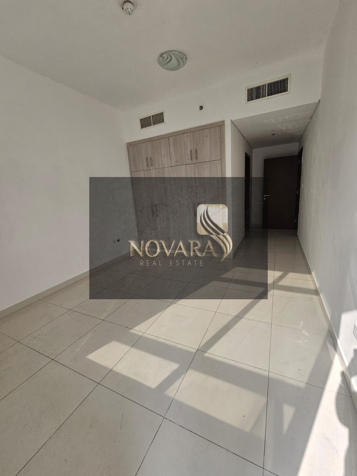 Two-bedroom apartment with a living room available for annual rent in a new tower (second occupant) in Al Rashidiya 3 area, one of the prestigious are