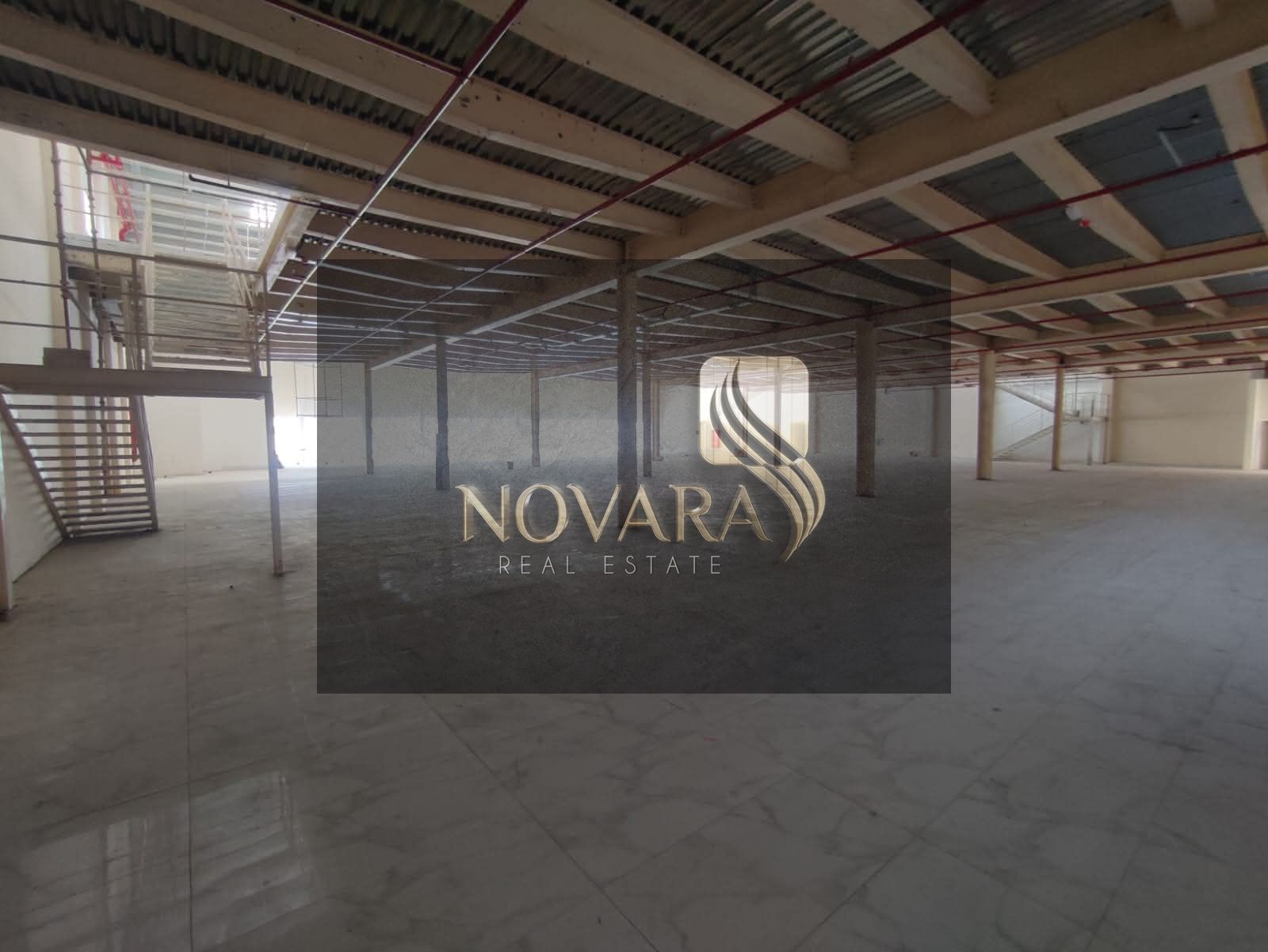 For rent: Prime showroom in Ajman, Al Jurf Industrial Area 3, 31,000 sq ft, with mezzanine and 100 kW electricity. Strategic location.