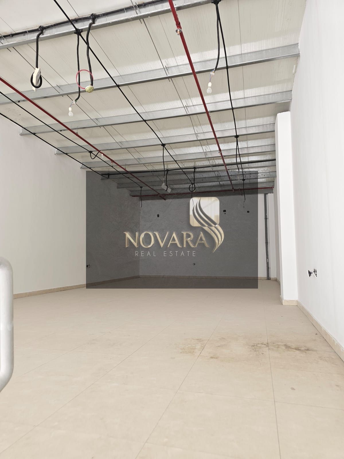 A prime showroom with a modern design is available for annual rent in a strategic location in Ajman Industrial Area, spanning 3250 square feet.