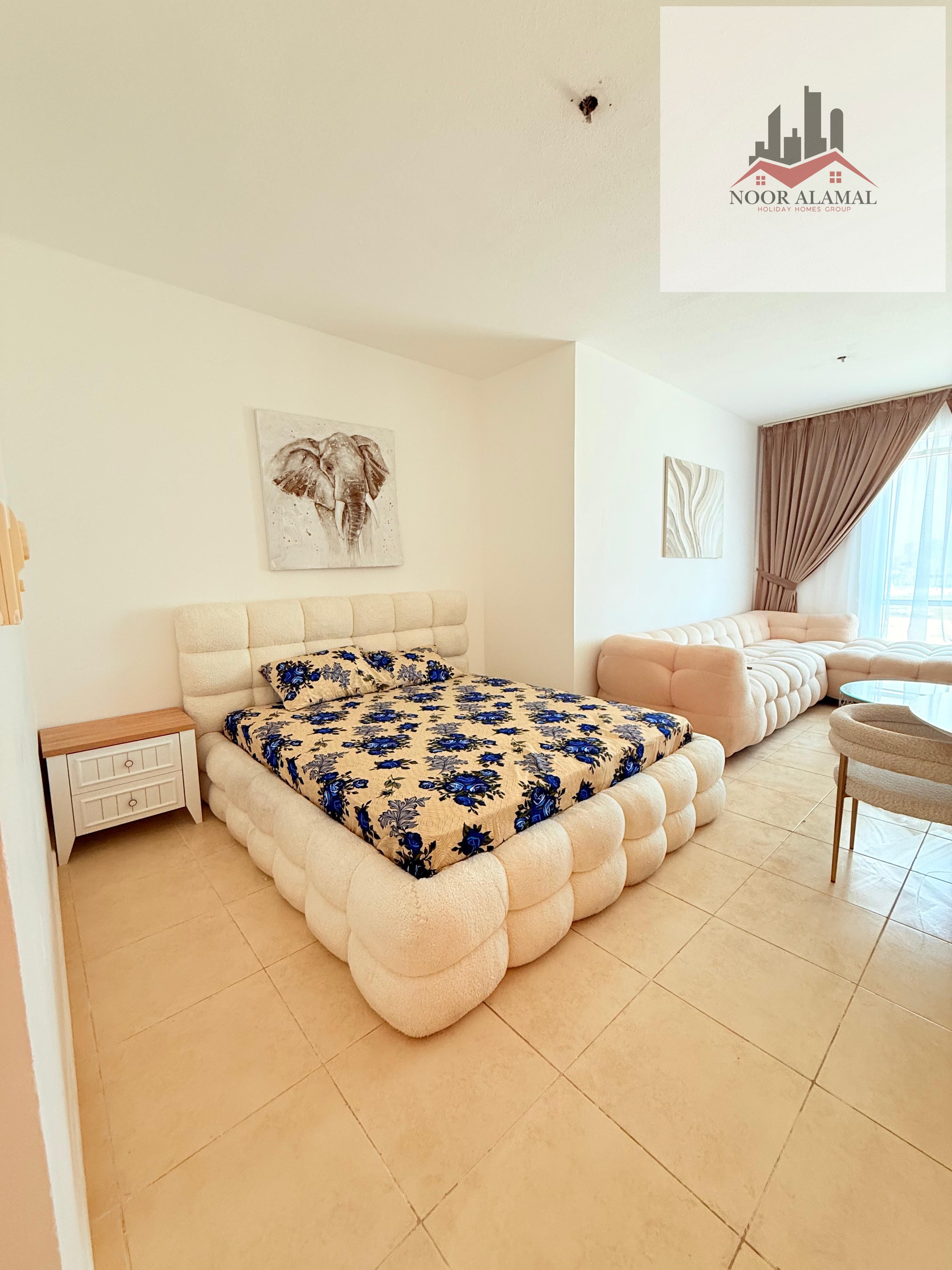 Sharjah, Al Khan, furnished studio apartment with hotel-style furnishings, first occupancy, spacious room, separate kitchen, bathroom, large window, s