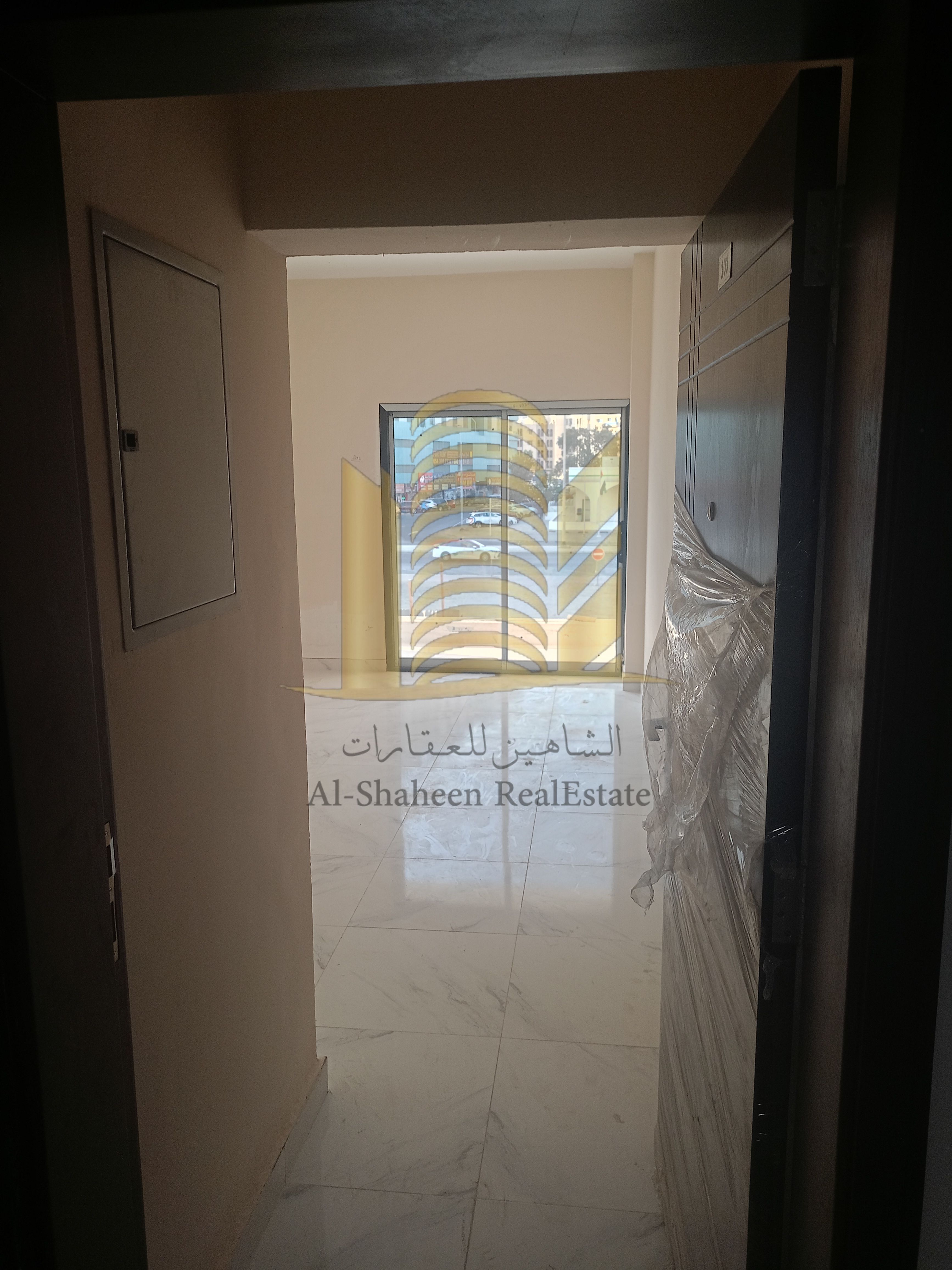 Two-bedroom apartment with a living room for annual rent in Al Rashidiya, next to Lulu Market, new building