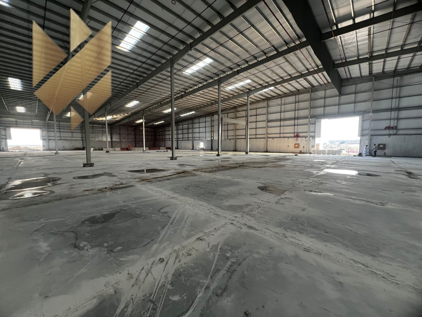 Warehouse for rent in Umm Al Quwain | Spacious areas | Strategic prime location | Suitable heights | Includes an office for business operations | Clos