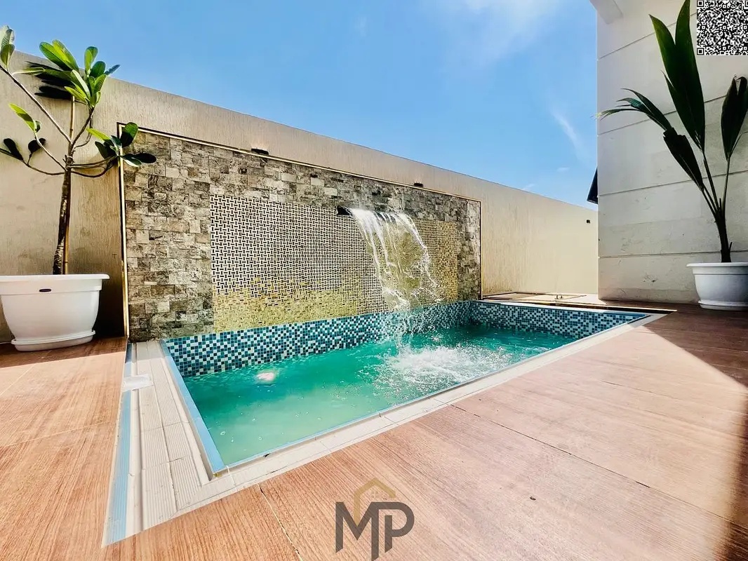A luxurious opportunity to own your dream villa in Al Bahia, Ajman. 7 master bedrooms + large swimming pool + modern design. Price includes registrati