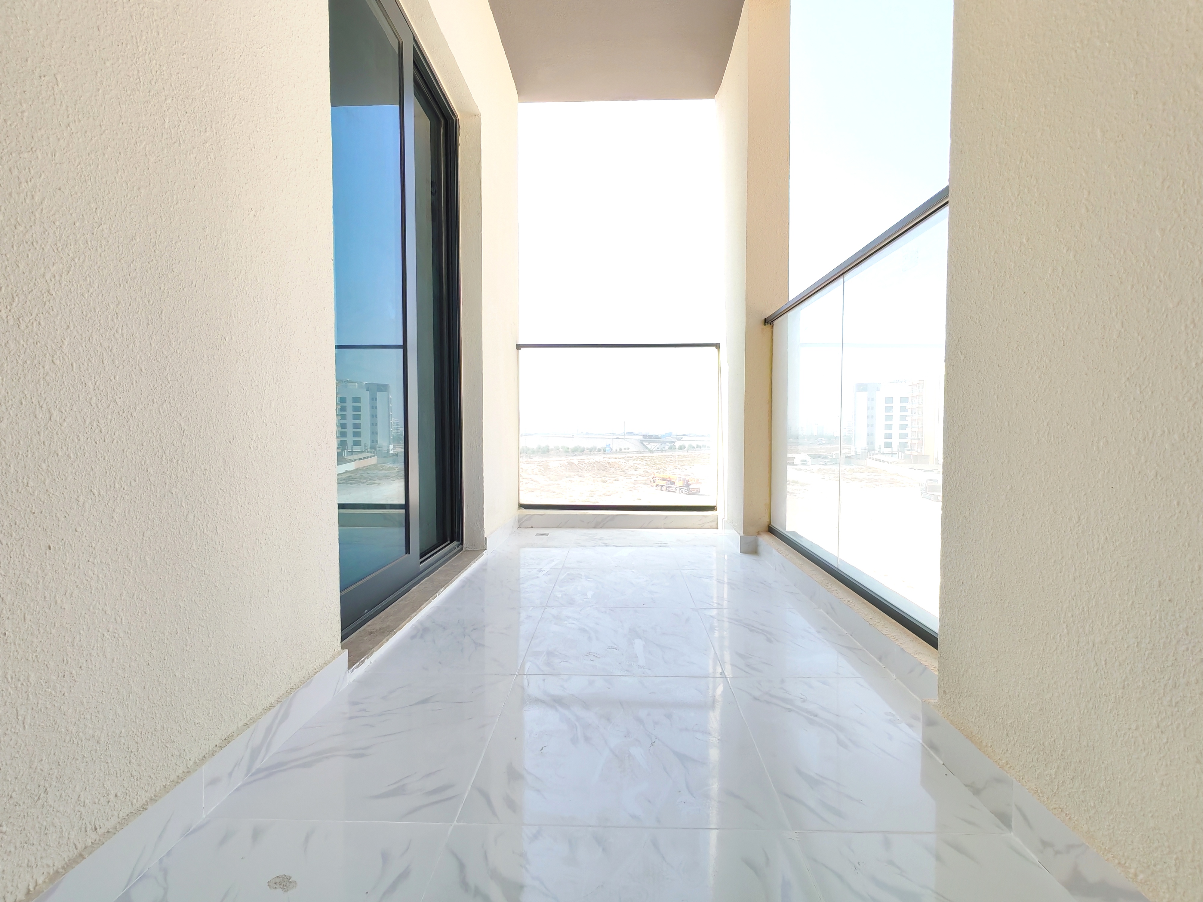 LIKE A NEW SPACIOUS 2 BEDROOM WITH CLOSED KITCHEN HAVING 2 BALCONIES WITH GYM POOL AND PARKING .