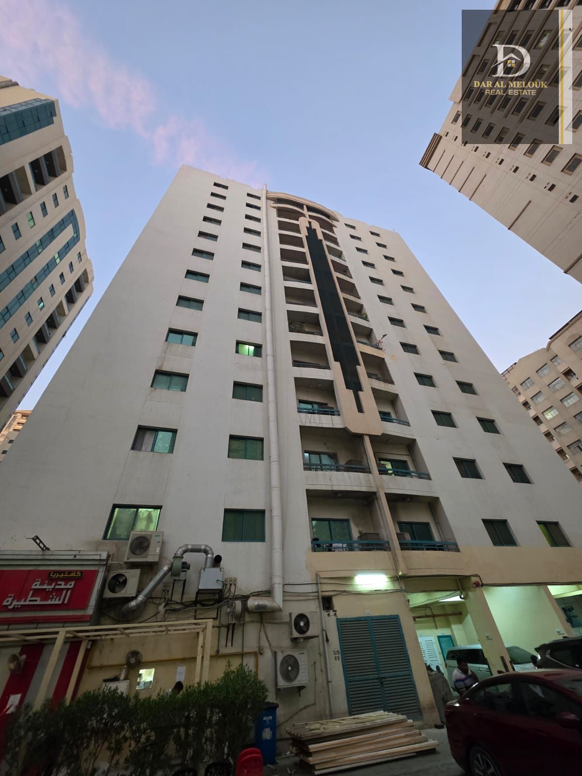 For sale in Sharjah, Al Qasimia area, a commercial/residential building with an area of 10,000 sq ft, corner plot on two streets.