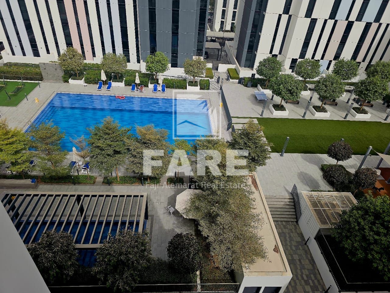 Swimming Pool View -Modern 1-Bedroom Apartment in Aljada – Sharjah