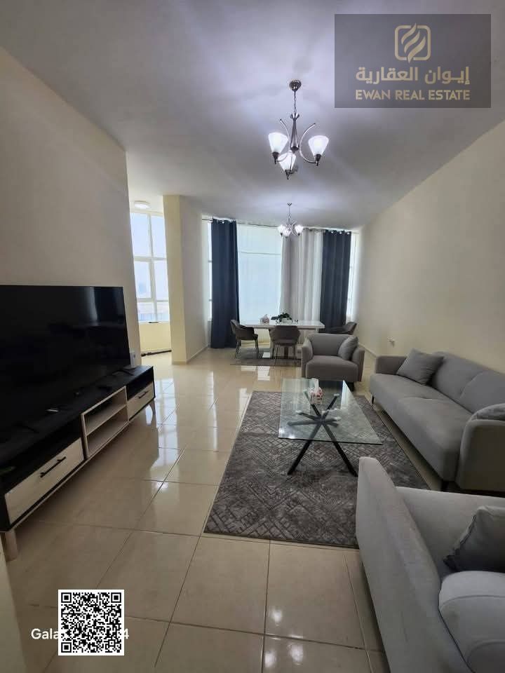 Furnished two-bedroom apartment with a living room for monthly rent in Ajman, Orient Towers. Inside the tower are a gym, swimming pool, garden, and pa