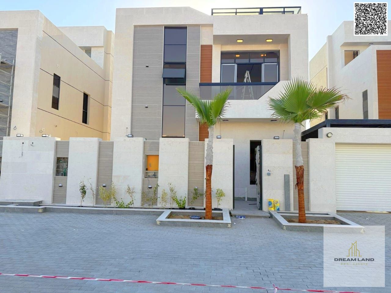 A uniquely designed modern villa with two floors and a rooftop, including electricity, water, and air conditioning. Prime location with a swimming poo