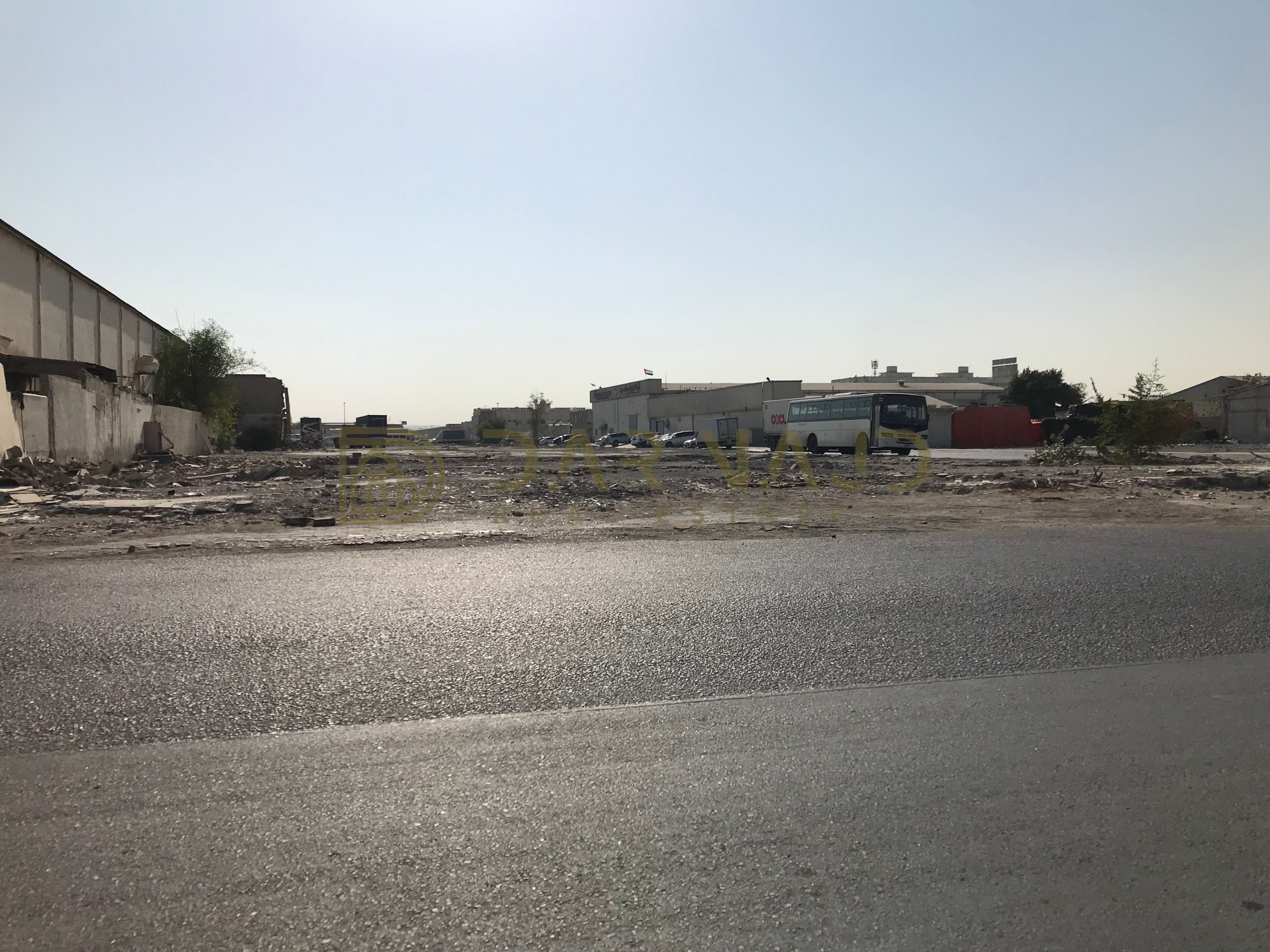 commercial land on main road for sale in Al Nahdha - Al Darari area