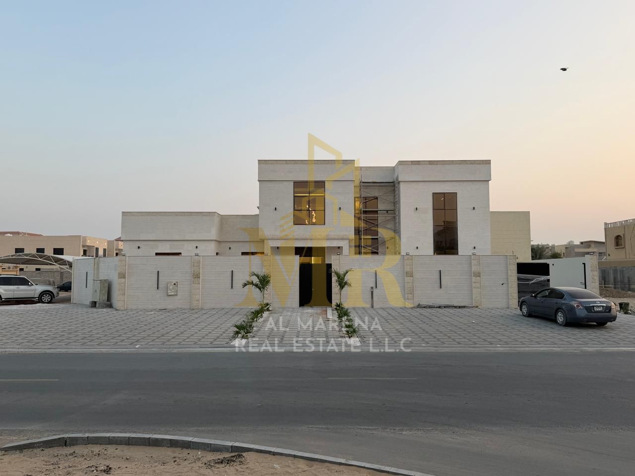 Villa for sale in Ajman. The villa is a G+1 (ground floor plus one) with electricity and water included, featuring 5 master bedrooms, a majlis (formal