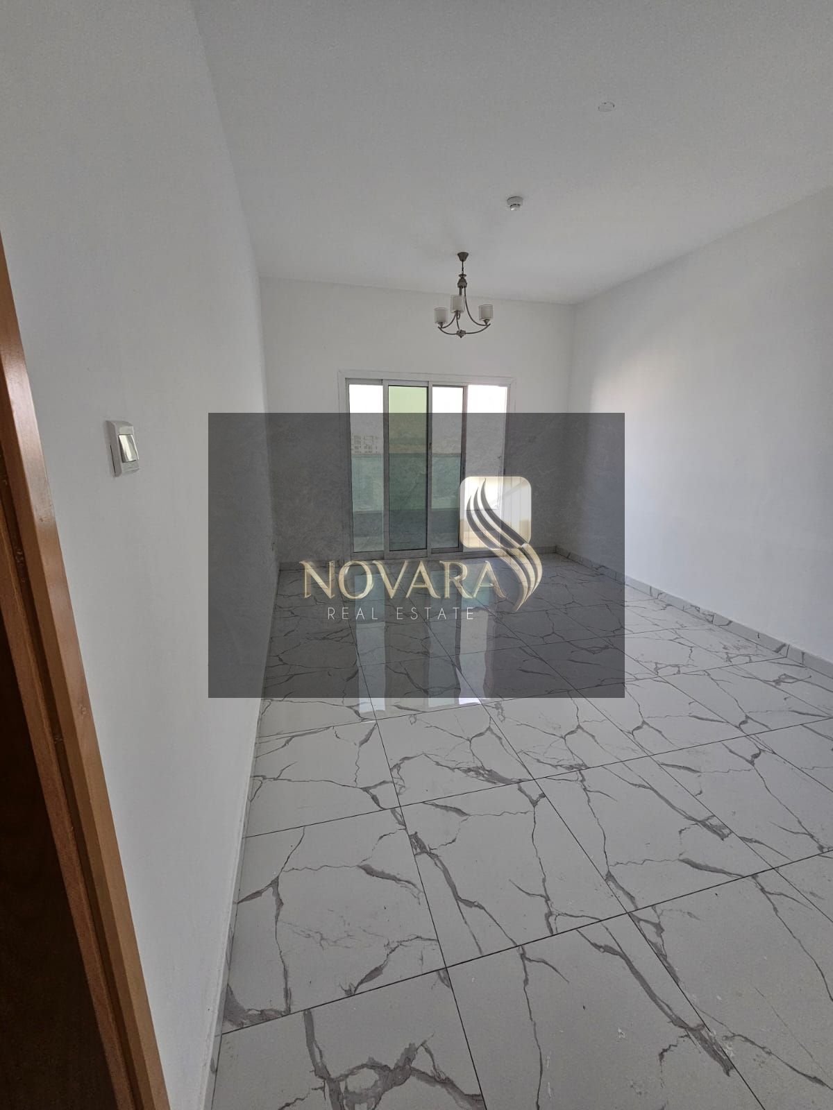 Apartment for annual rent, two bedrooms and a living room, in Al Jurf Industrial Area, 3 spacious separate living rooms.