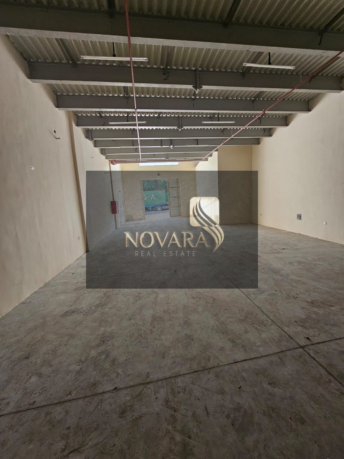A prime warehouse is available in a strategic location in Al Jurf Industrial Area 1, with an area of 3900 square feet, ready for immediate occupancy