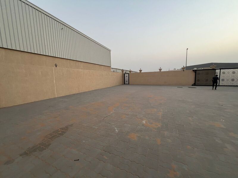 For rent: a walled plot of land measuring 24,500 square feet with an 11,000-square-foot warehouse inside.