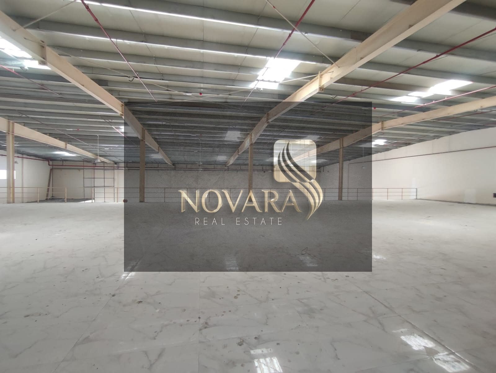 Showroom for rent in Al Jurf Industrial Area 3, 31,000 sq ft with mezzanine and 100 kW electricity, on a main street