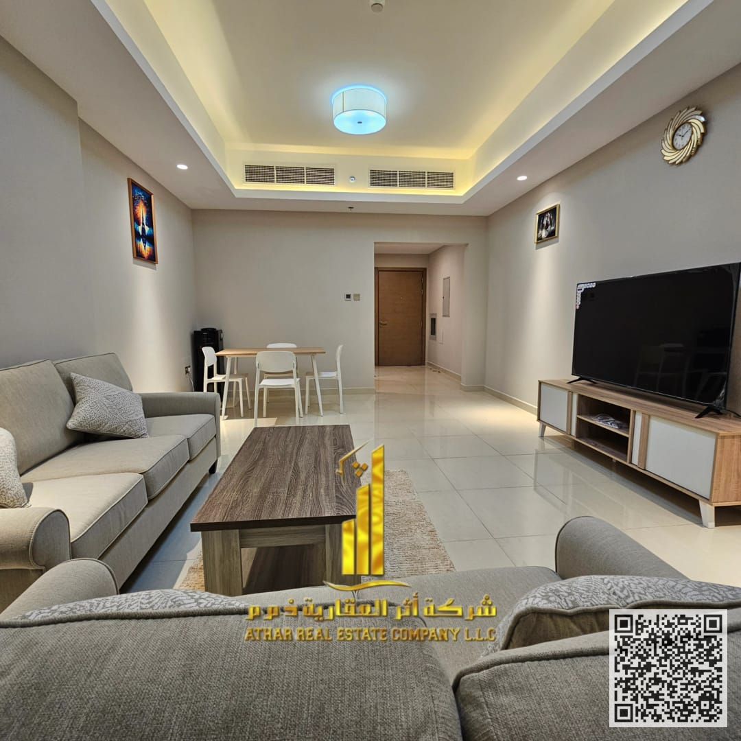 Two-bedroom apartment with a living room, fully furnished with new furniture, available for monthly rent in Ajman - Al Rashidiya 1 - Gaulf Tower.