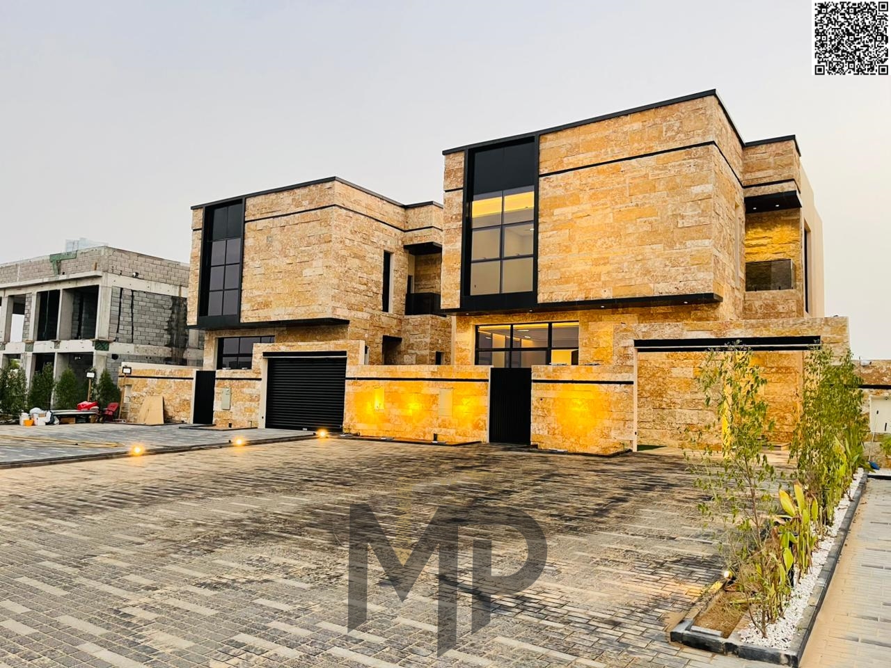 Villa for sale directly from the owner in Al Zahia with a 20-meter front setback and a stone facade. The villa includes registration and ownership fee