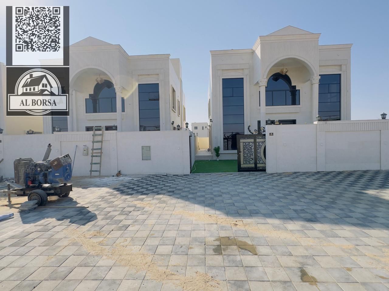 For sale in Al Helio 2, Ajman: a villa with 5 master bedrooms, a majlis, two living rooms, two kitchens, and a maid's room.