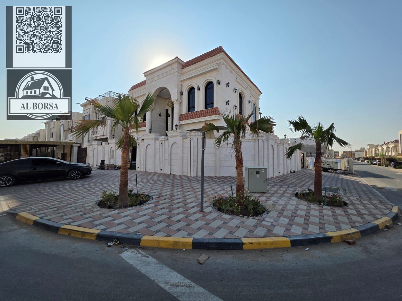 For sale: Corner villa on two streets, super deluxe finishing, in Al Helio 2, Ajman. 5 master bedrooms, majlis, and two living rooms.