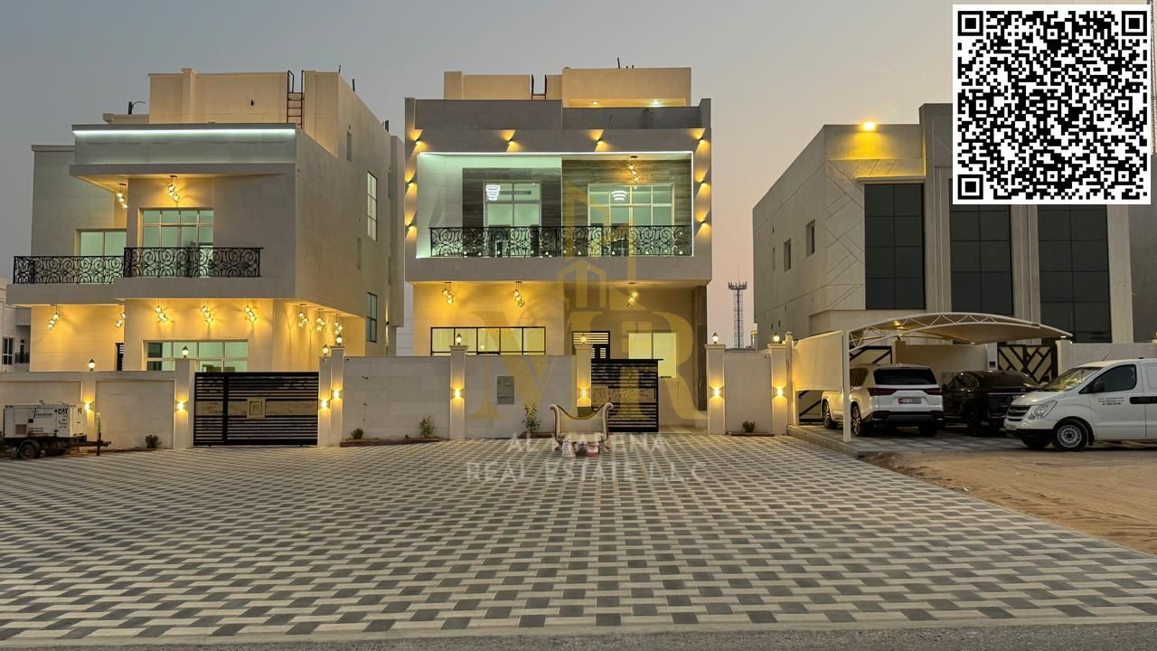 Luxury villa for sale in Al Helio 2 area – Ajman, corner plot on two streets, includes central air conditioning, freehold ownership for all nationalit