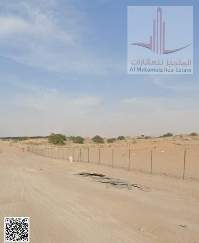 For sale in Ajman Global City, Al Aaliyah residential/commercial land with a permit for a tower (ground floor, 6 parking spaces, and 15 repeated floor