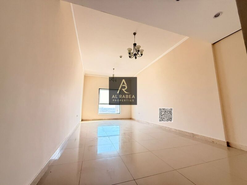 Luxury two-bedroom apartment with a living room, three bathrooms, and a balcony in Al Nuaimiya 1