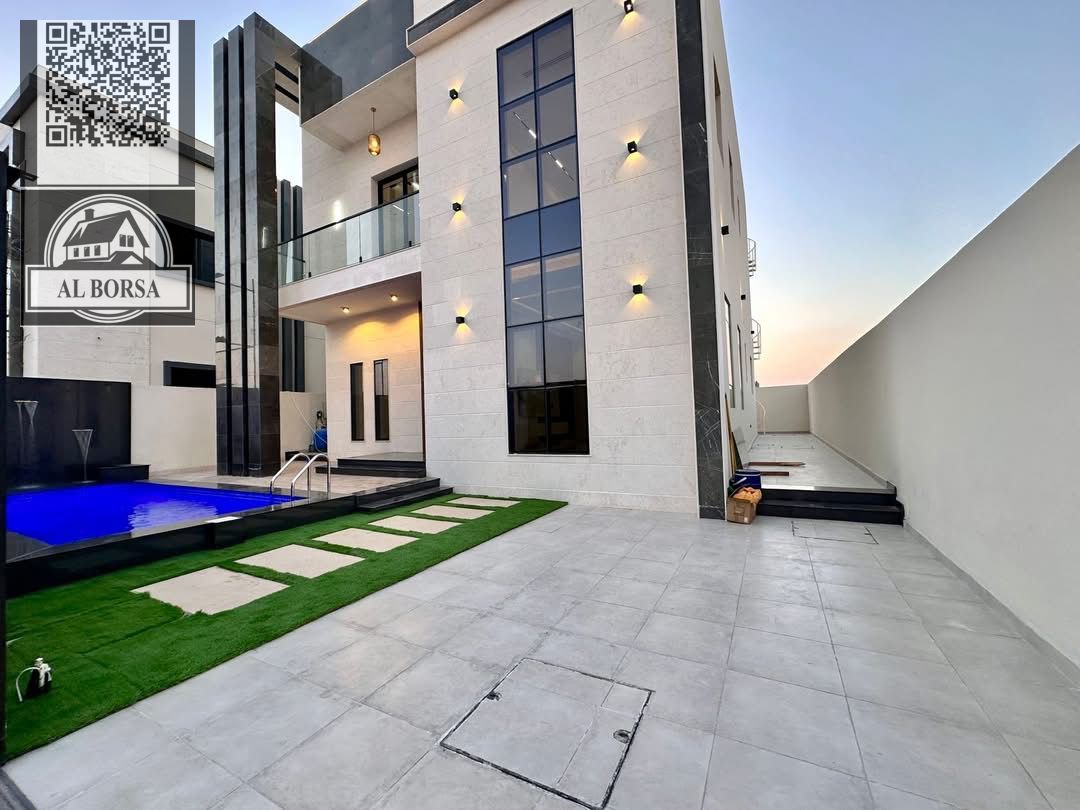 For sale in Al Bahia, Ajman: a villa with 4 master bedrooms, a majlis, a living room, and a swimming pool.