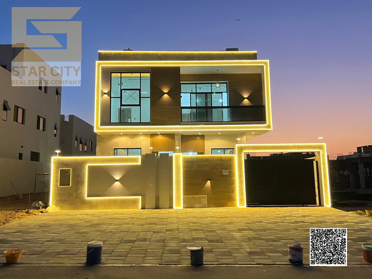 Modern luxurious villa for sale in Ajman with full central AC, three floors, parking, and special cash offer