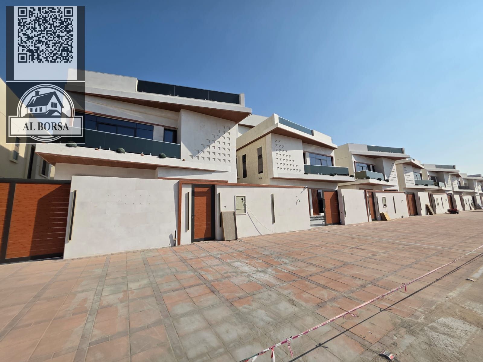 For sale in Al Helio 2, Ajman: a villa with 5 master bedrooms, a majlis, 3 living rooms, 2 kitchens, a maid's room, and a swimming pool.