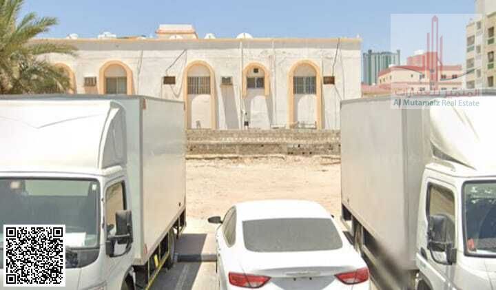 Land for sale in Ajman, Al Nuaimiya 2, residential/commercial G+4 , 3596 sq ft, corner plot with street and alley permit. Asking price: AED 1,600,000