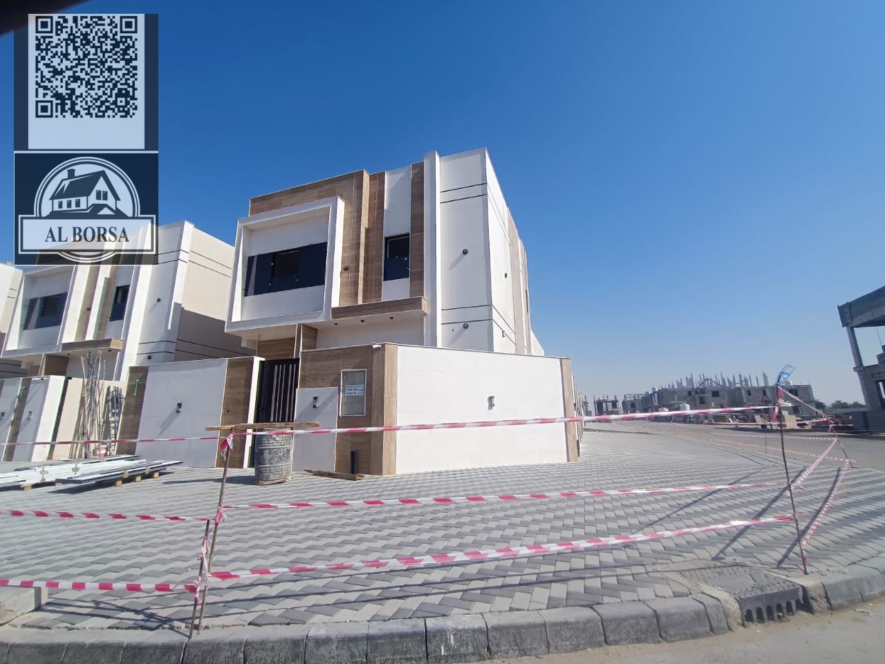 For sale in Al Helio 2, Ajman: a villa with 4 master bedrooms, a majlis, a living room, a spacious kitchen, and a maid's room.