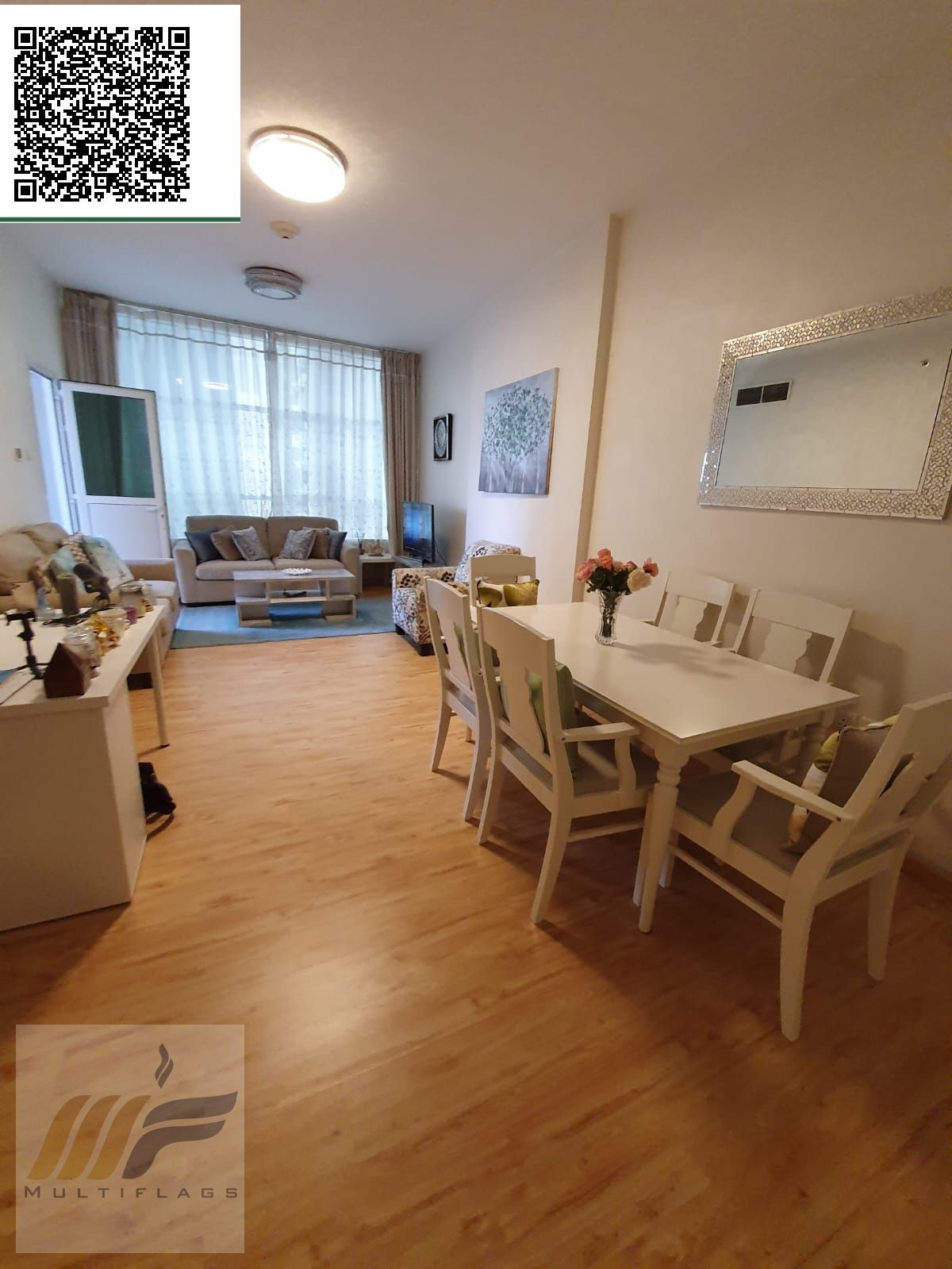 Elegant one bedroom apartment with living room in Orient Tower Ajman featuring modern design comfortable space prime location and serene lifestyle