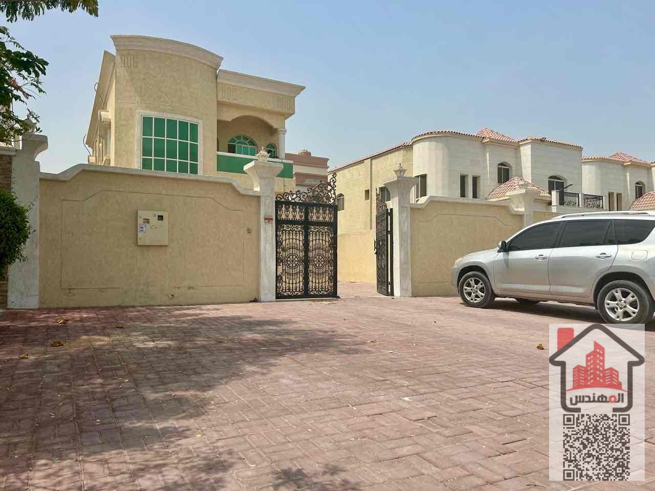 A two-story villa for rent in Ajman, Al Rawda 3, consists of 5 bedrooms, a living room, and air conditioning. The villa's area is 5,000 square feet. It is located in a prime location on an asphalt road. The required annual rent is 90,000 dirhams.