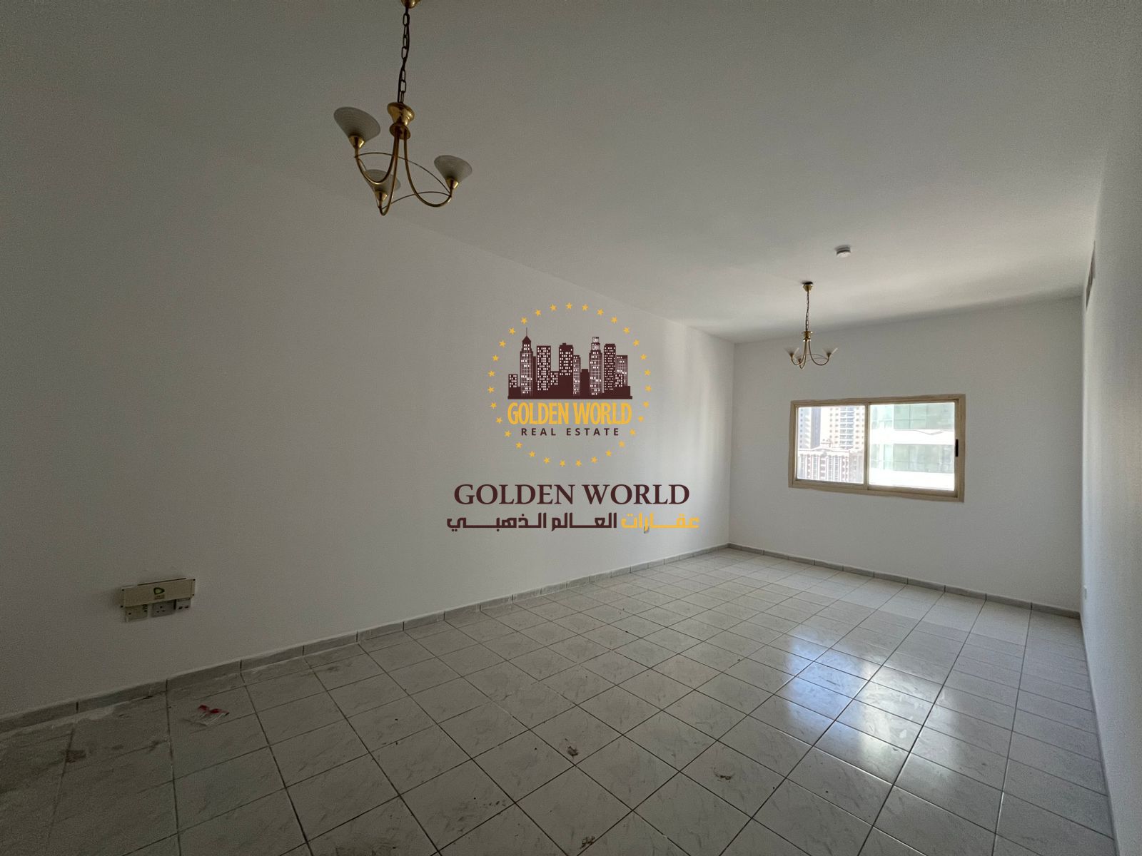 Spacious 2-bedroom apartment with a bright living room and a balcony for rent in Al Majaz 3.