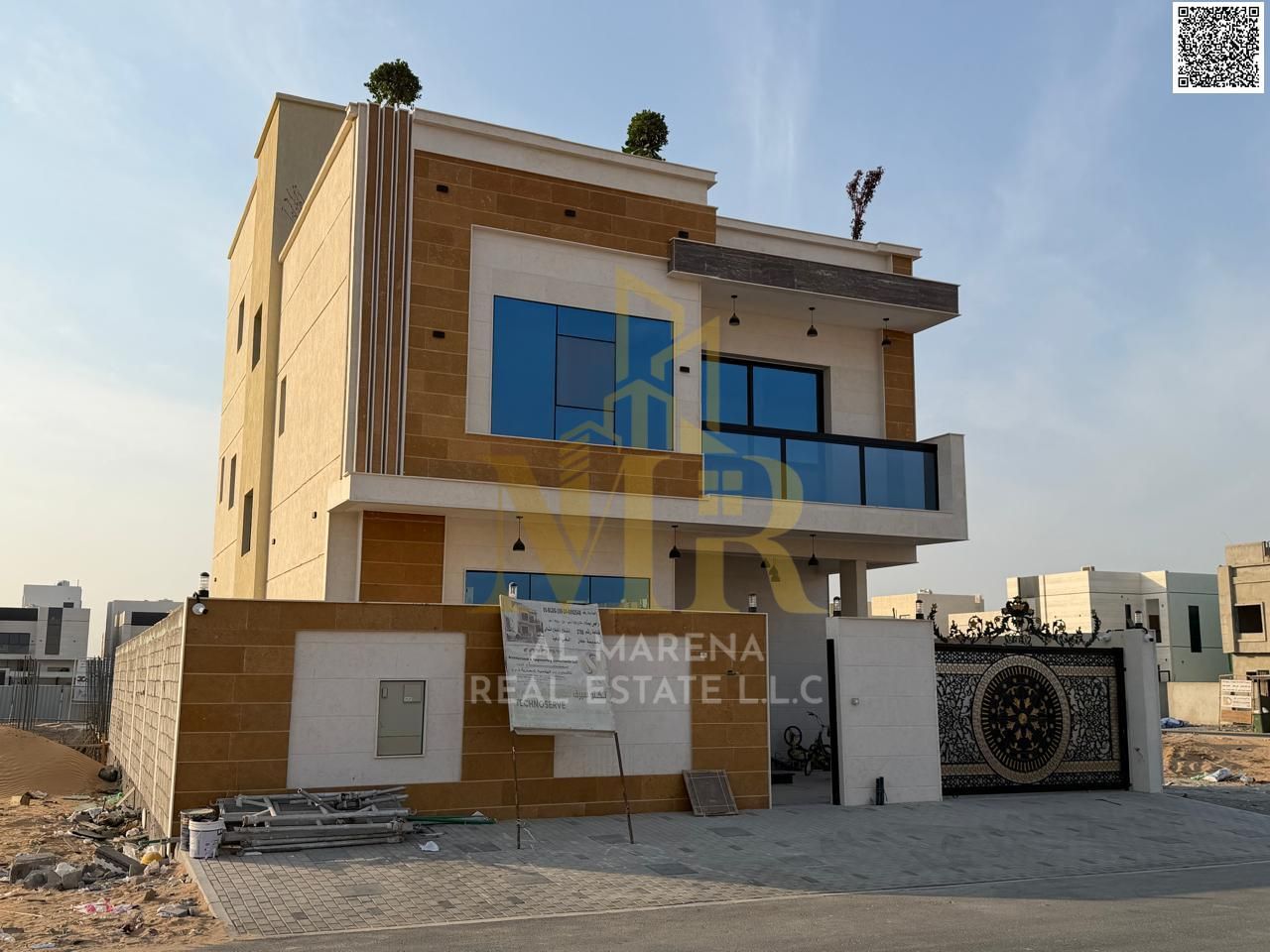 A two-story villa with a rooftop terrace in Al Bahia, with all registration and ownership fees included, located on the main street and ready for imme