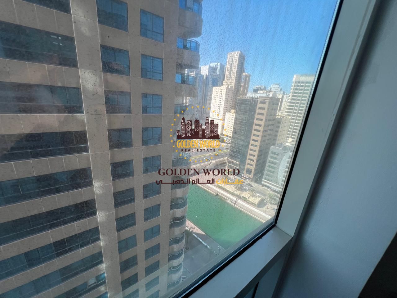 Modern 2-bedroom apartment in Al Majaz 3, Al Qasba. Features a spacious balcony, two bathrooms, and dedicated parking. A prime location offering comfo