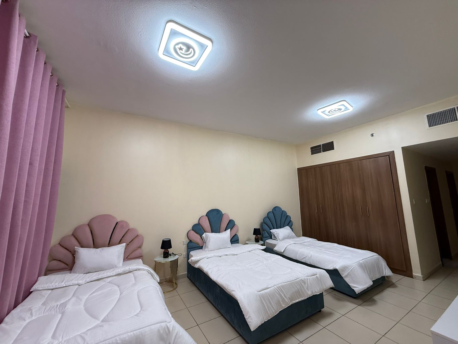 Two-bedroom apartment with a living room in Ajman, Al Rashidiya area.