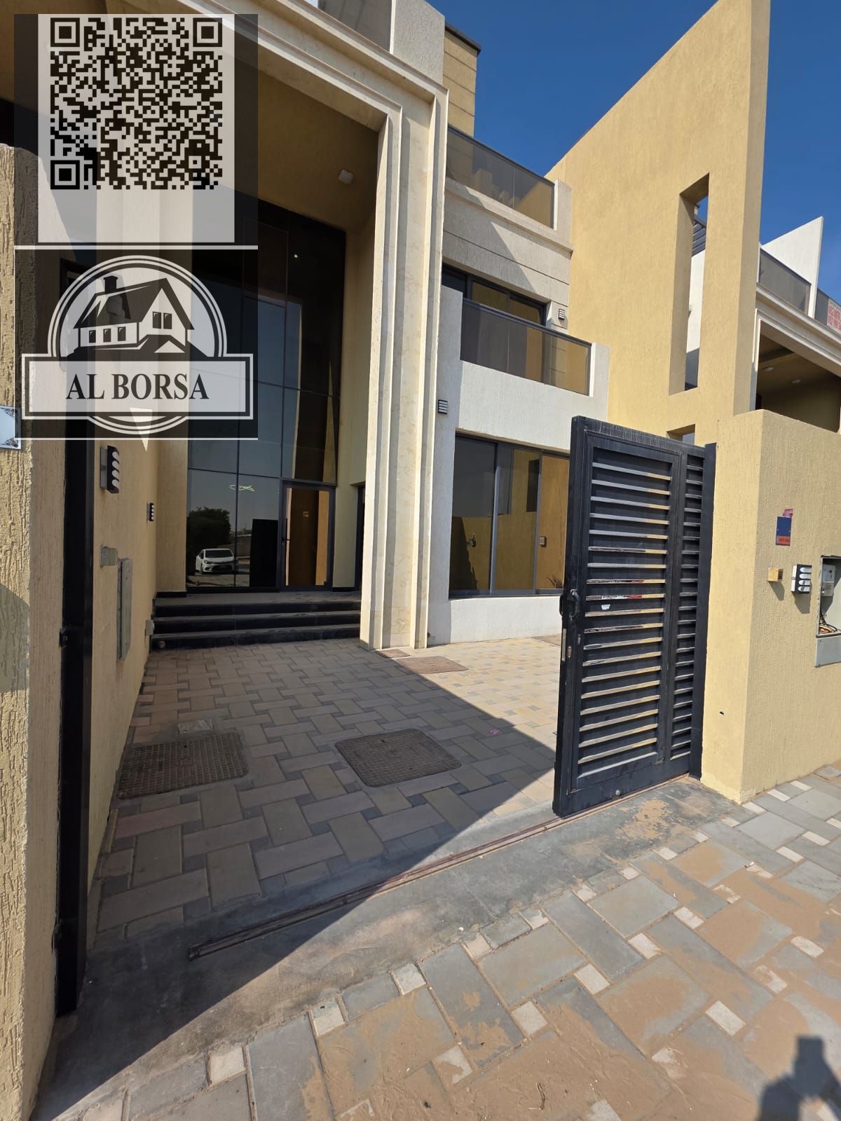 For sale in Ajman, Al Zahiyah area, a townhouse with electricity and air conditioning, two floors plus a roof, 4 master bedrooms, 2 living rooms, a ma
