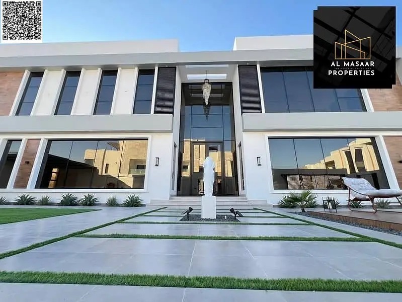 Freehold ownership for all nationalities: A very luxurious villa for sale in the Al Zahiyah area of Ajman, with an elegant design that combines arch