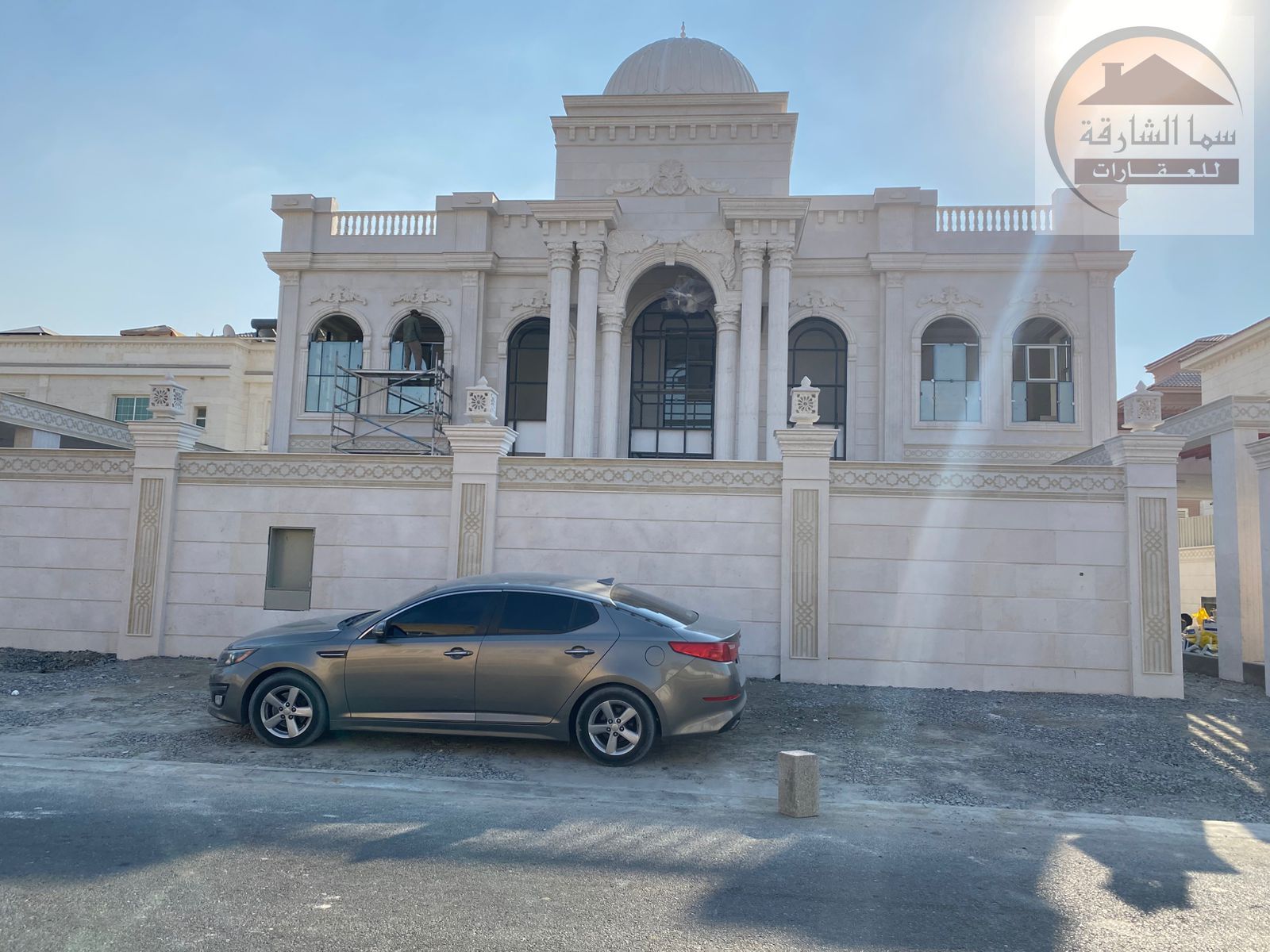 A miniature palace that combines the classic design of a stone facade, a dome, and towering columns, with a modern finishing house with a smart system