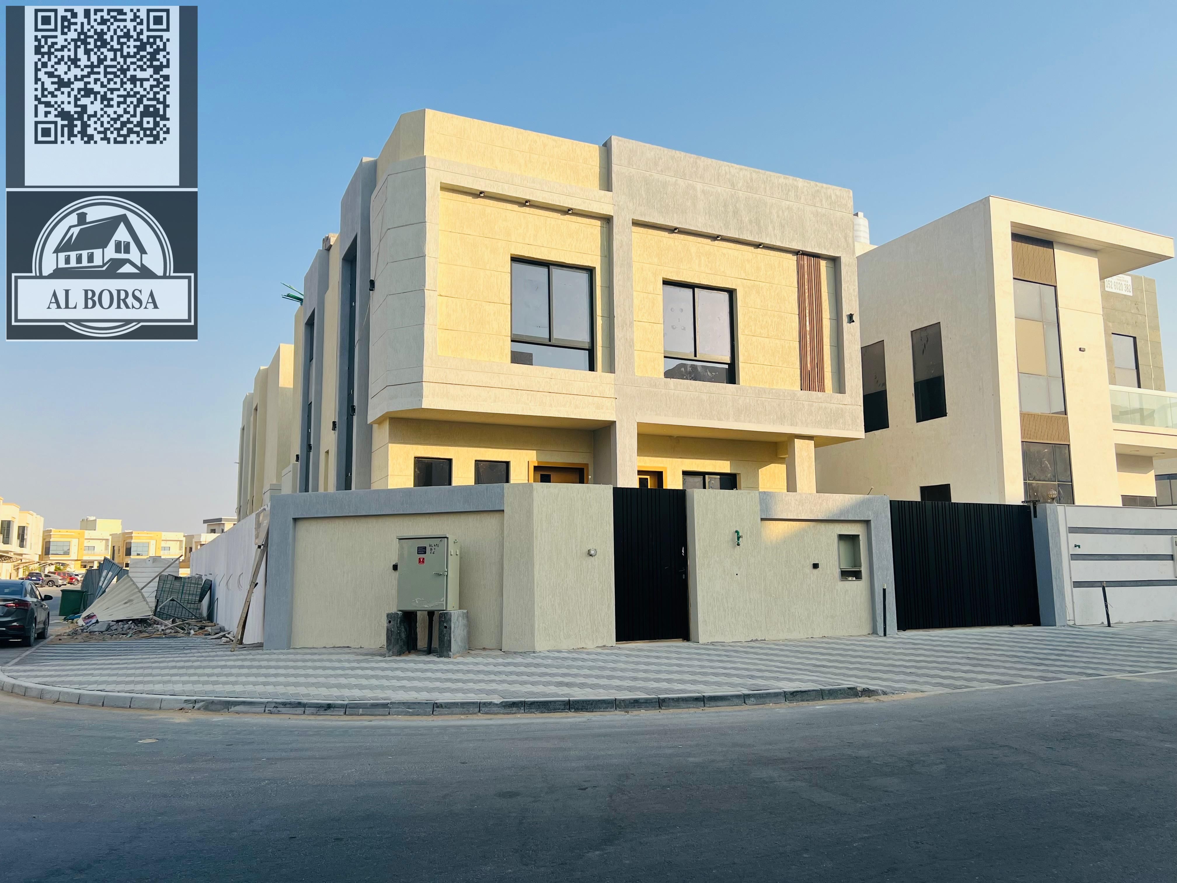 For sale in Al Yasmin, a corner villa with 5 master bedrooms, a majlis, a living room, a kitchen, and a maid's room.