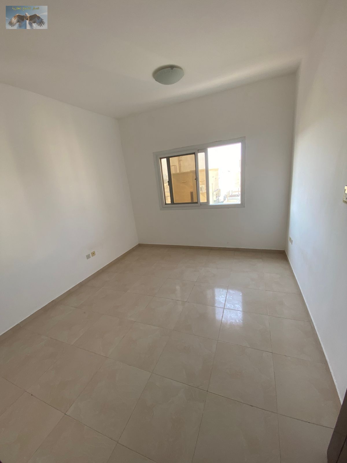 A golden opportunity for annual rent in Al Jurf: a luxurious two-bedroom apartment with a living room.