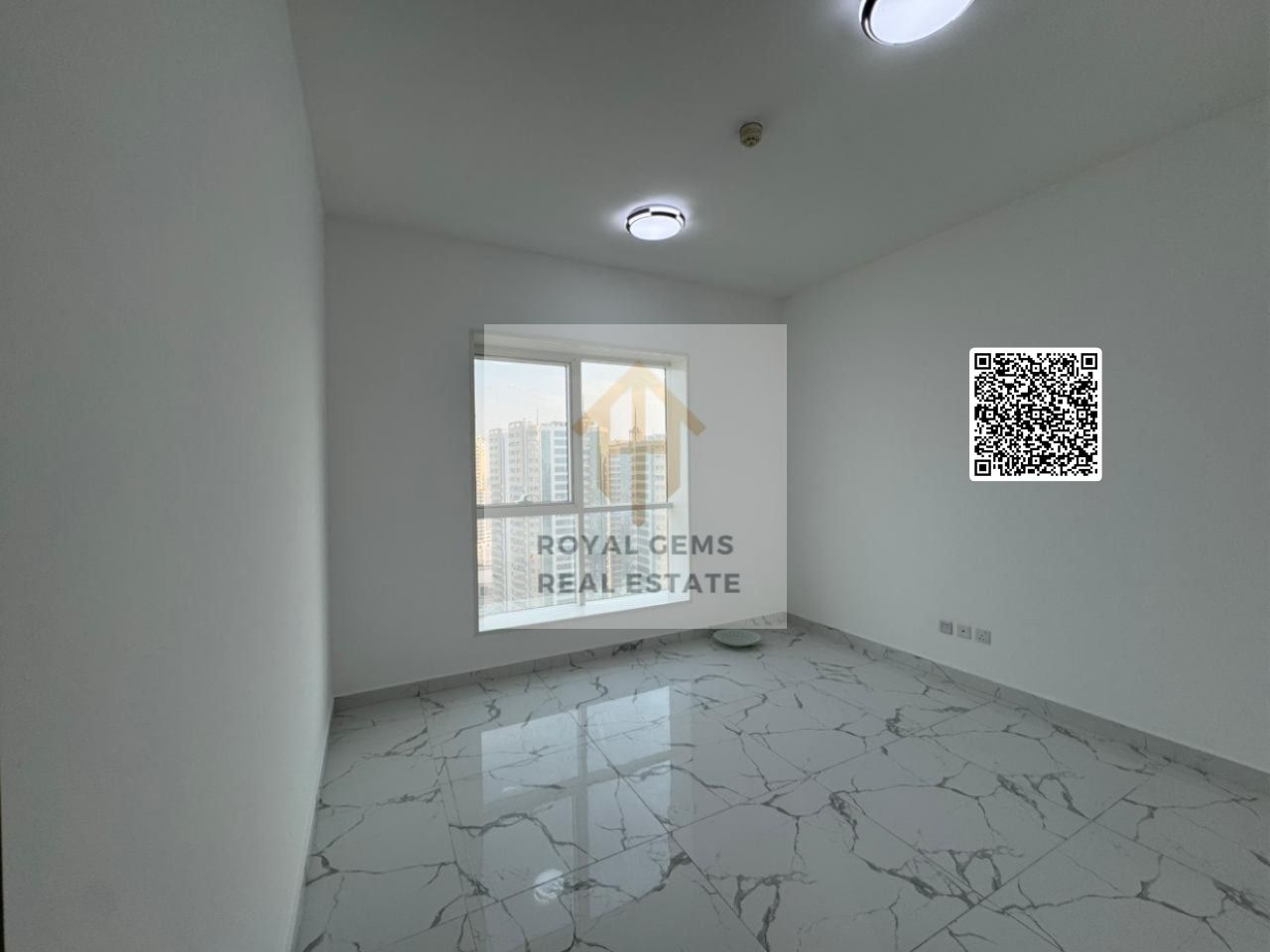 Luxury three-bedroom apartment in Ajman, Oasis Towers | 3 bathrooms | Spacious living room | 2 balconies | Private parking | Gym and swimming pool |