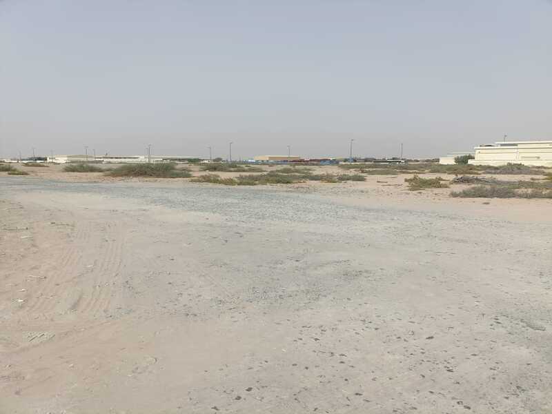 Industrial land for sale in Al Qasimia, with an area of 19,370 square feet.