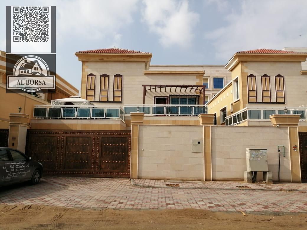 For sale in Al Muwaihat 2, a villa with 6 master bedrooms, a majlis, a living room, a maid's room, and a spacious kitchen.