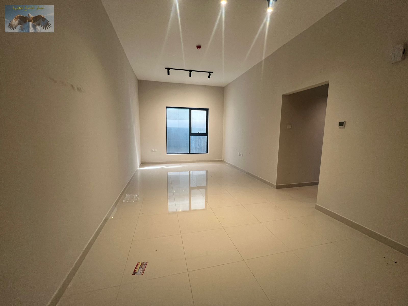 Two-bedroom apartment with built-in wardrobes, spacious layout, second occupant, private parking, gym, and a hotel-style entrance.