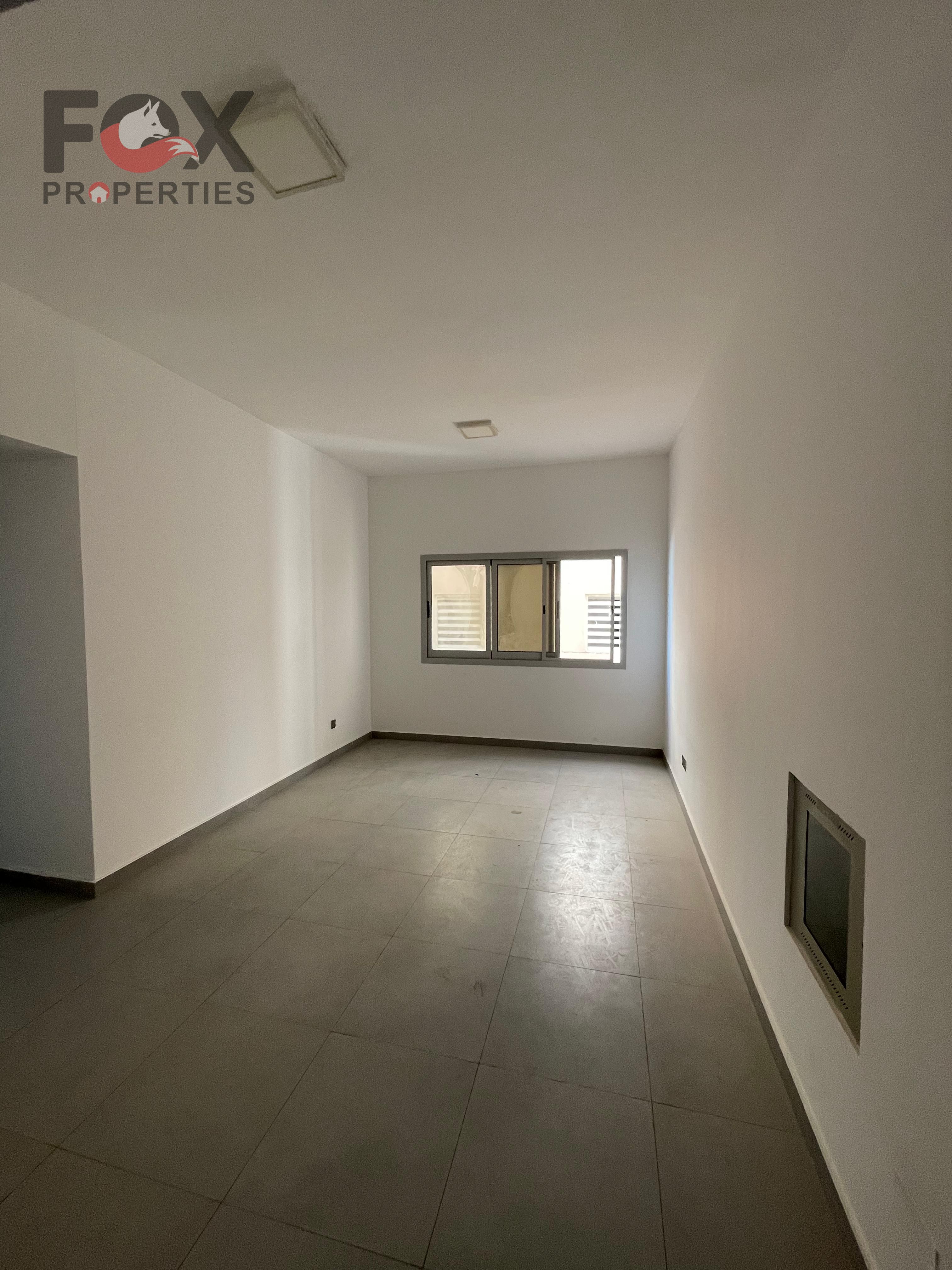 Second tenant, two-bedroom apartment with a living room for annual rent in Al Rawda 1. Spacious layout, central air conditioning.