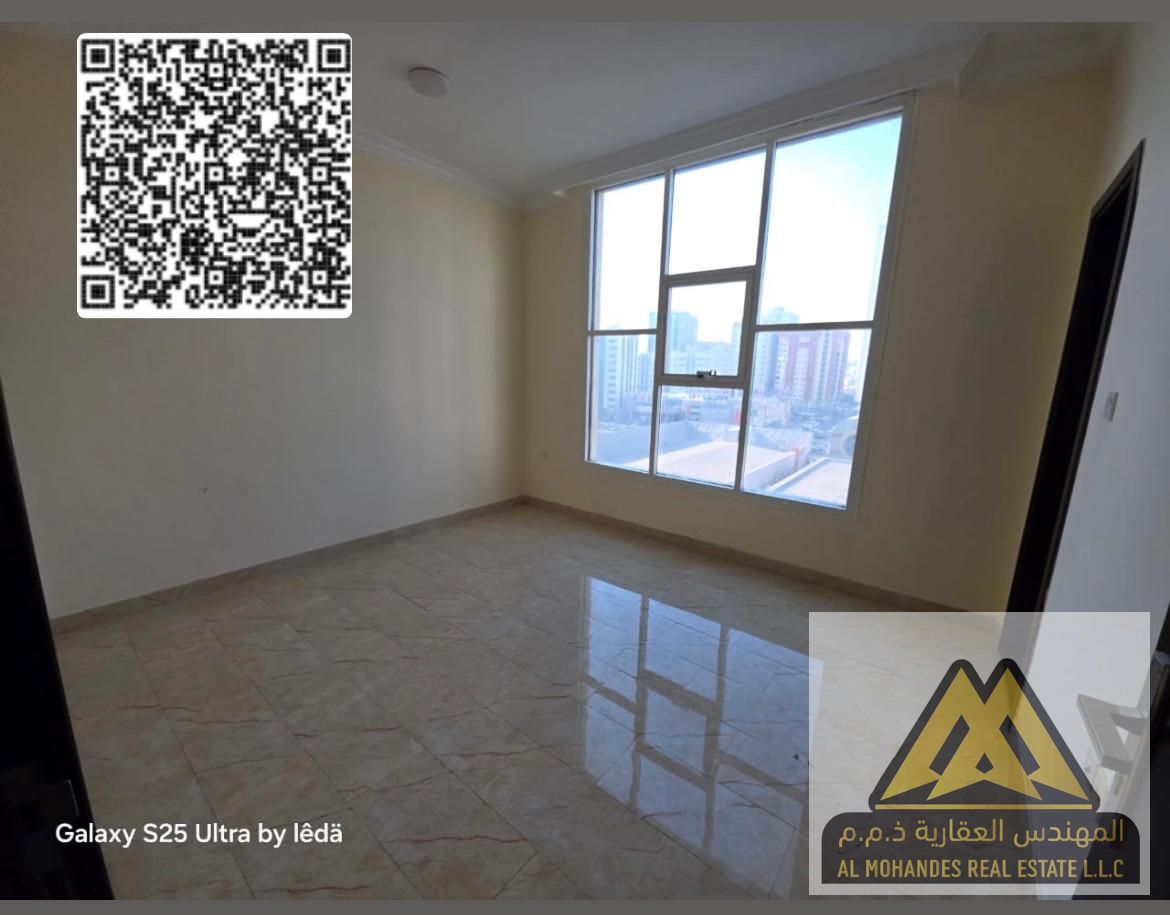 Annual rent apartment available in Al Nuaimiya 1, near the industrial area, featuring a prime location and open panoramic view with a spacious balcony